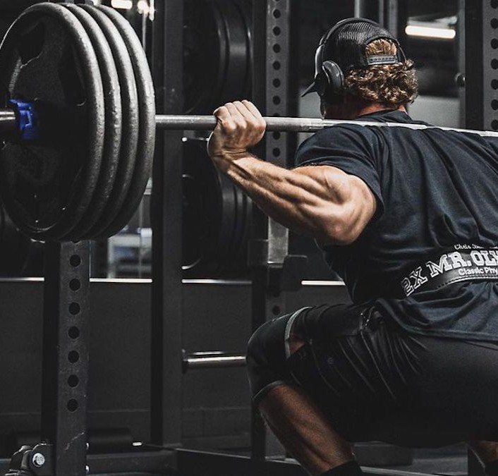 Strength and Power winner performing a heavy squat